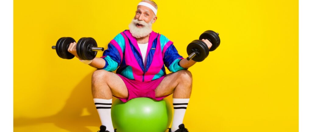 senior sportsman lift dumbbell sit fitball dressed retro sport costume