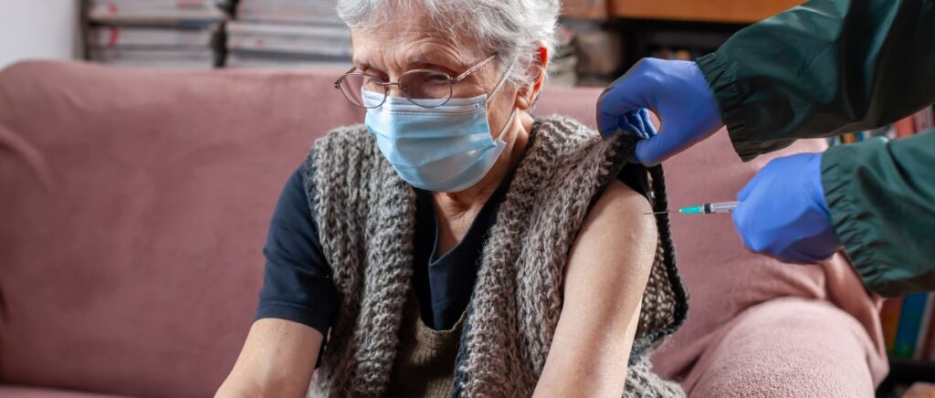 senior woman receiving vaccine