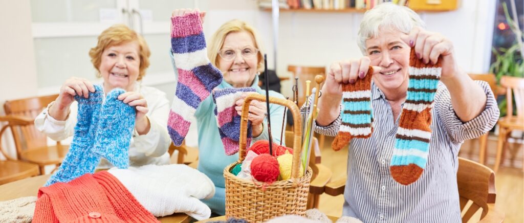 Seniors proudly display self-knitted socks