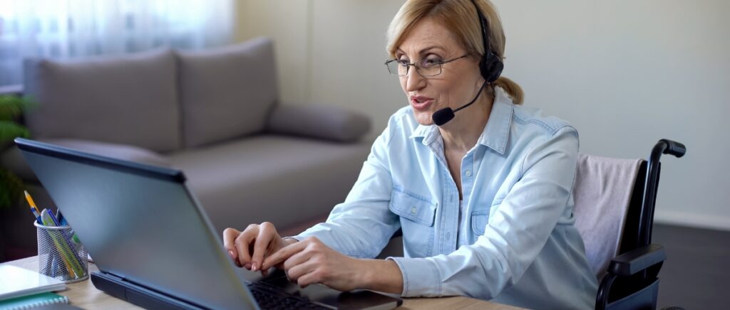 senior in a wheelchair working from home