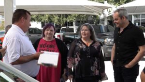 Woman receiving new car