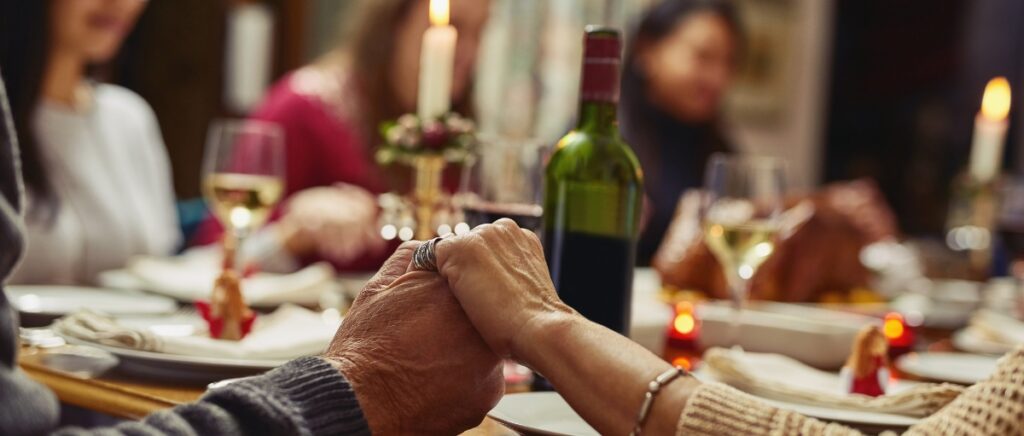 Family, people holding hands in prayer