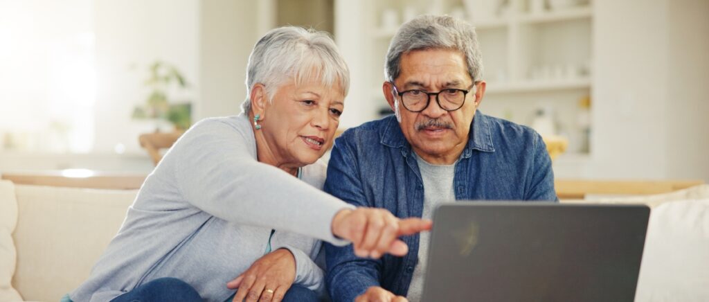 Senior couple using a laptop.