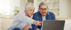 Senior couple using a laptop.