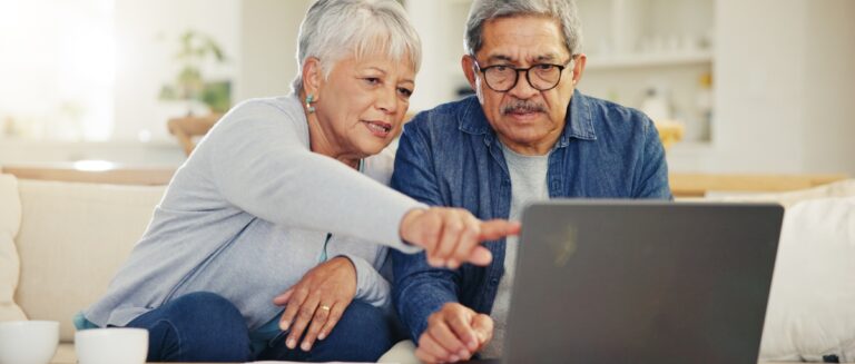 Senior couple using a laptop.