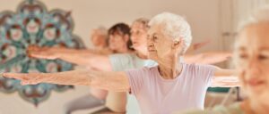 Senior women doing yoga.