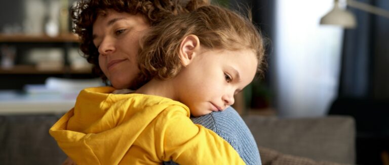 Mother comforting her upset deeply feeling kid