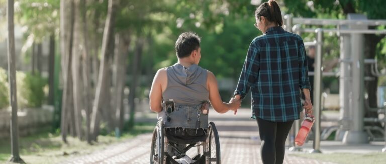 Disabled man in wheelchair at the park.