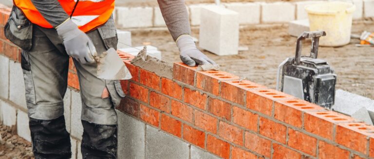 Stock image used to represent the rebuilding of a retaining wall—reflecting the real-life story of a senior couple who received help after being scammed.