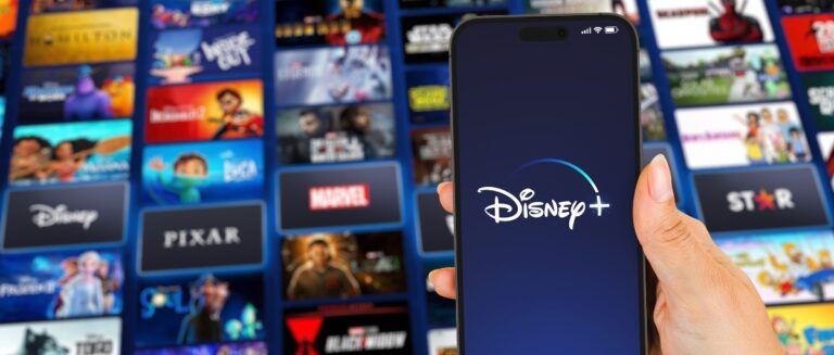 smartphone with Disney Plus (Disney+) app on the screen.